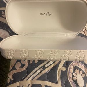White Oakley glasses case.